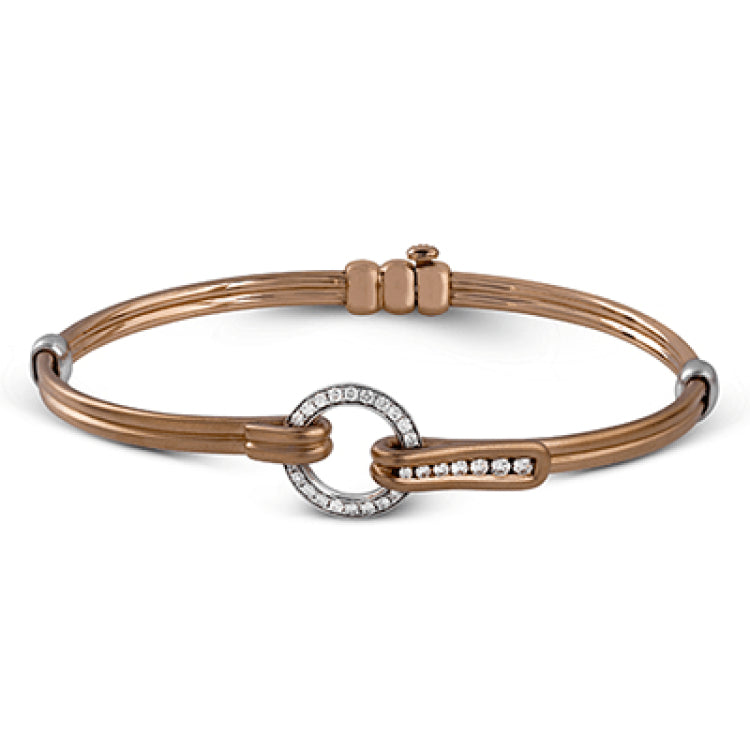 This wonderful 18k gold bracelet would be perfect for everyday wear with .39 ctw of white diamonds set into a circular buckle design.