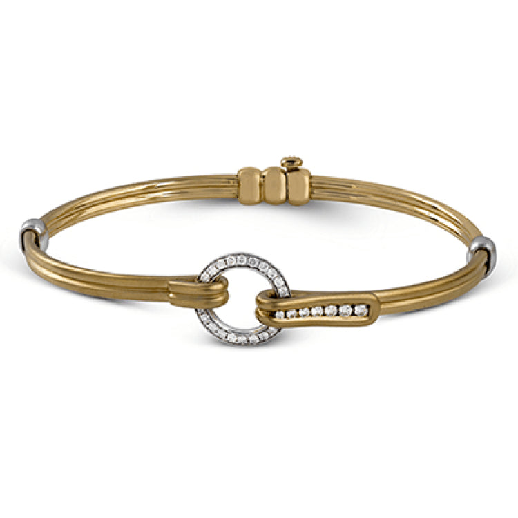 This wonderful 18k gold bracelet would be perfect for everyday wear with .39 ctw of white diamonds set into a circular buckle design.