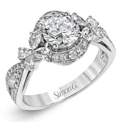 Dramatic yet romantic, this exquisite white gold engagement ring features .30 ctw of round cut white diamonds highlighted by .54 ctw of pear shaped diamonds in delicate floral motifs.