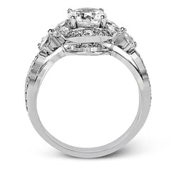 Dramatic yet romantic, this exquisite white gold engagement ring features .30 ctw of round cut white diamonds highlighted by .54 ctw of pear shaped diamonds in delicate floral motifs.