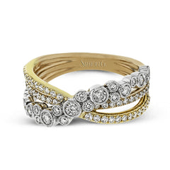 This modern tri-tone 18k gold ring features an overlapping design containing .73 ctw of shining white round brilliant diamonds.