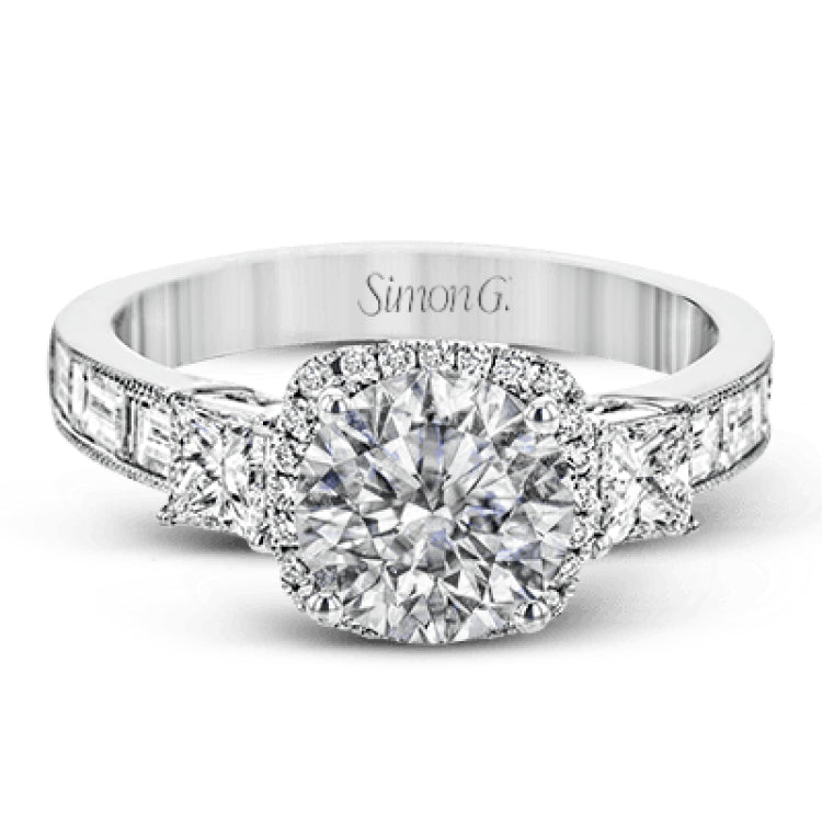 The impressive circular halo of this white gold engagement ring is set with .10 ctw round cut white diamonds and emphasized by .43 ctw princess cut diamonds and .58 baguette cut diamonds.