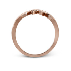 Two delicately leafed branches form the stage for this contemporary rose gold ring, accented with .21 ctw of brilliant white diamonds.