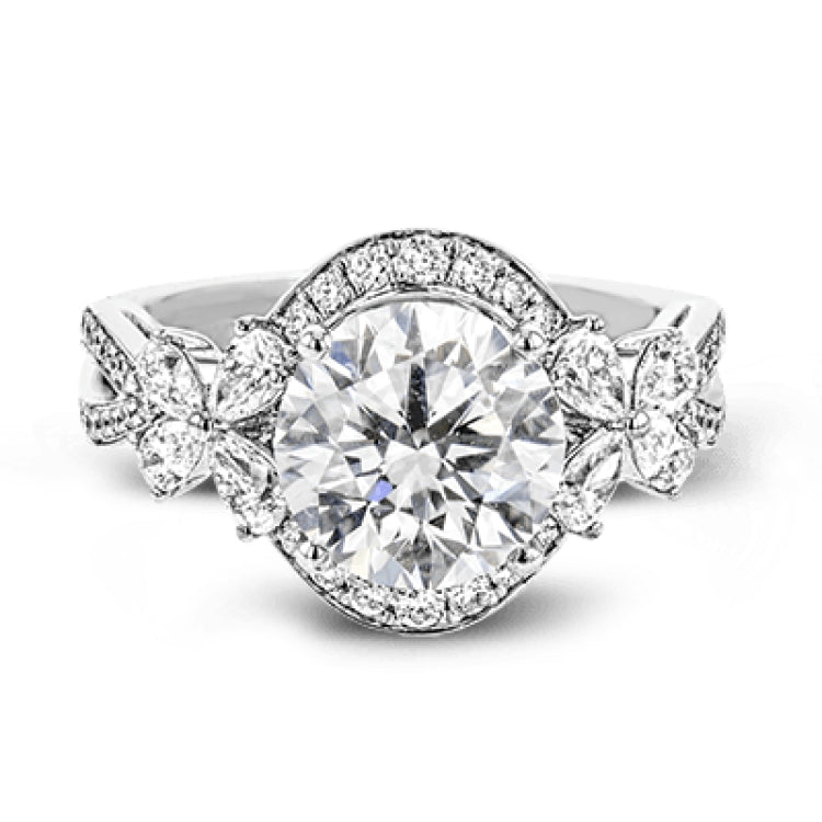Dramatic yet romantic, this exquisite white gold engagement ring features .61 ctw of round cut white diamonds highlighted by .58 ctw of pear shaped diamonds in delicate floral motifs.