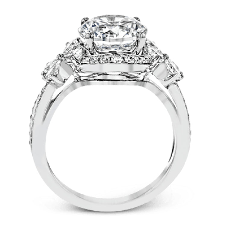 Dramatic yet romantic, this exquisite white gold engagement ring features .61 ctw of round cut white diamonds highlighted by .58 ctw of pear shaped diamonds in delicate floral motifs.
