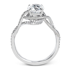 Classic with a modern twist, this white gold engagement ring features .50 ctw of sparkling white diamonds in a dramatic openwork design.