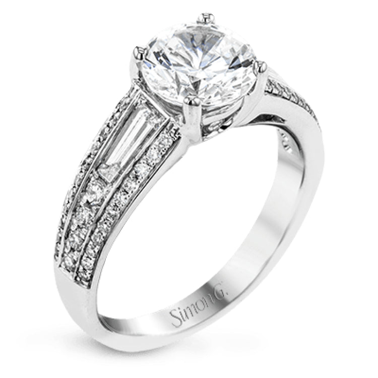 The charming design of this white gold contemporary ring is accented by .36 ctw baguette cut diamonds and .33 ctw round cut white diamonds.