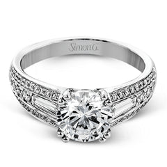The charming design of this white gold contemporary ring is accented by .36 ctw baguette cut diamonds and .33 ctw round cut white diamonds.