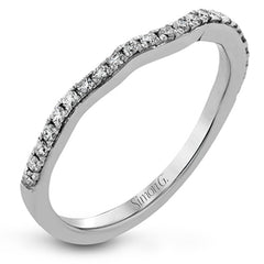 Presenting a dramatic contemporary design, this two-tone engagement ring is highlighted with .42 ctw of sparkling white diamonds.