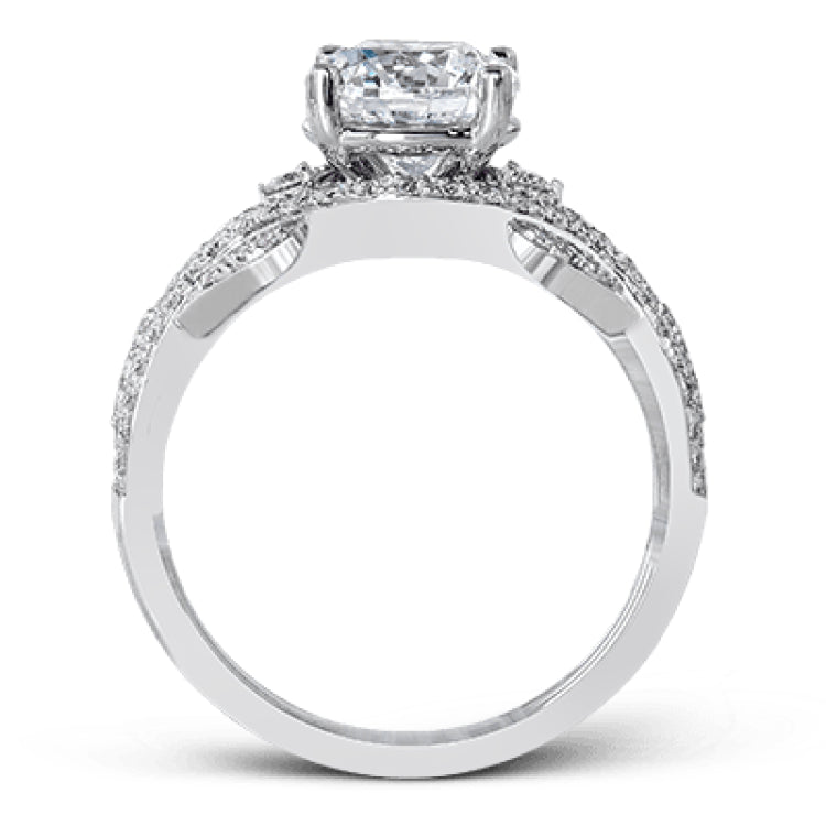 Presenting a dramatic contemporary design, this two-tone engagement ring is highlighted with .42 ctw of sparkling white diamonds.