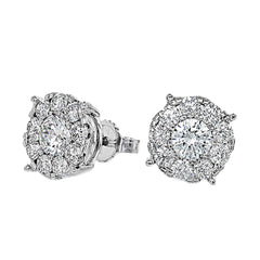 These 18k white gold stud earrings feature .50 ctw diamond centers surrounded by .57 ctw of smaller round white diamonds.