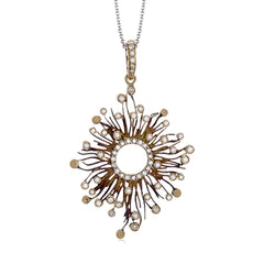 Presenting a contemporary twist on a time-honored vintage sunburst design, this stunning pendant showcases .42 ctw of shimmering white diamonds.