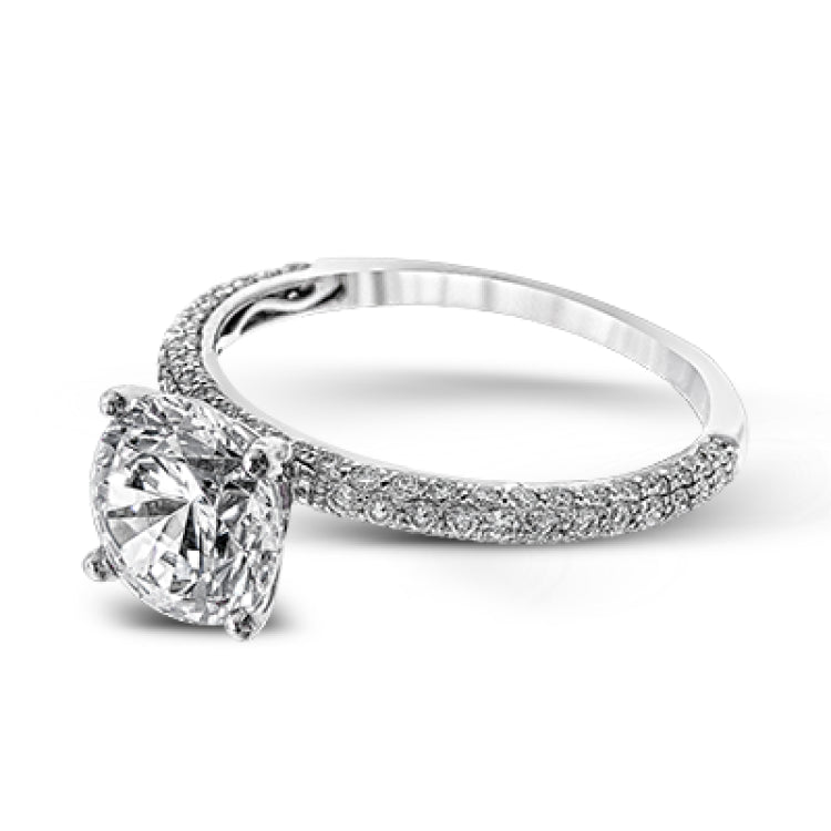 This absolutely exquisite white gold engagement ring dazzles the eye with round white diamonds.