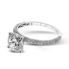 This absolutely exquisite white gold engagement ring dazzles the eye with round white diamonds.