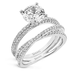 This absolutely exquisite white gold engagement ring dazzles the eye with round white diamonds.
