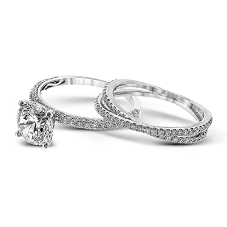 This absolutely exquisite white gold engagement ring dazzles the eye with round white diamonds.