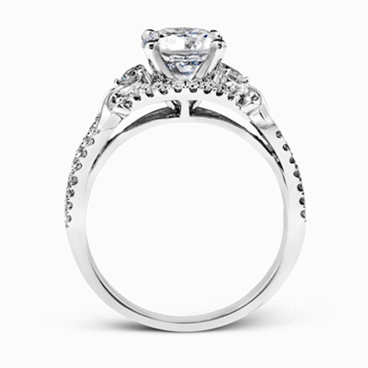 Featuring a delicately twisted shank, this brilliant white gold engagement ring and complimentary wedding band are set with .55 ctw of round cut white diamonds.
