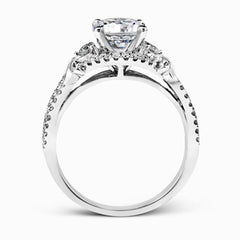 Featuring a delicately twisted shank, this brilliant white gold engagement ring and complimentary wedding band are set with .55 ctw of round cut white diamonds.