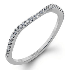 Featuring a delicately twisted shank, this brilliant white gold engagement ring and complimentary wedding band are set with .55 ctw of round cut white diamonds.