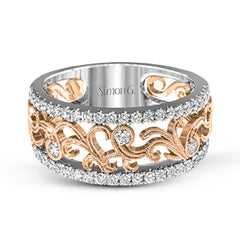 This vintage-inspired 18k white gold band features a detailed, floral design bordered by .52 ctw of white round brilliant diamonds.