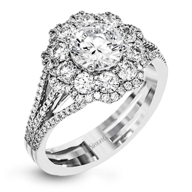 This lovely modern white gold ring features an eye-catching cluster halo set with .97 ctw shimmering round cut white diamonds.