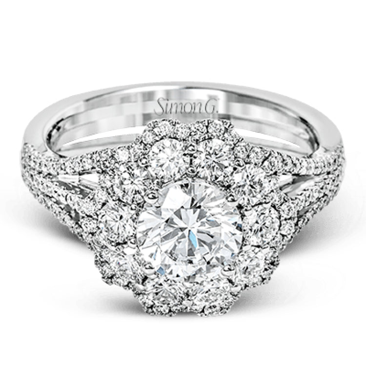 This lovely modern white gold ring features an eye-catching cluster halo set with .97 ctw shimmering round cut white diamonds.