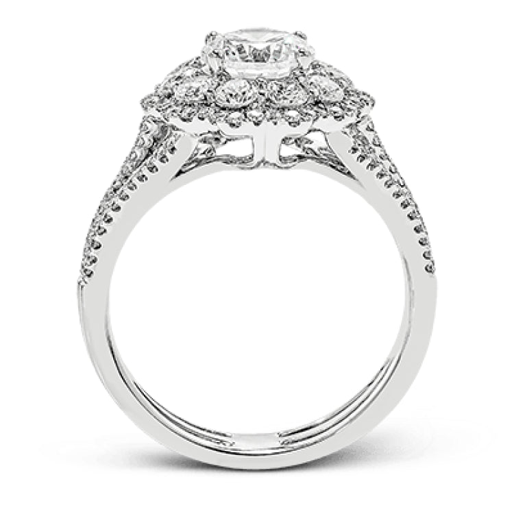 This lovely modern white gold ring features an eye-catching cluster halo set with .97 ctw shimmering round cut white diamonds.