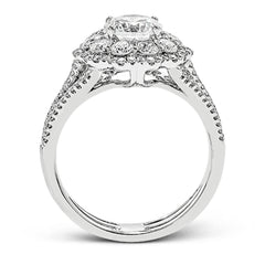 This lovely modern white gold ring features an eye-catching cluster halo set with .97 ctw shimmering round cut white diamonds.