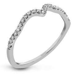 Featuring delicate floral designs on the shank, this modern white gold ring is complemented by .19 ctw of round cut white diamonds and .02 ctw pink diamond accents.