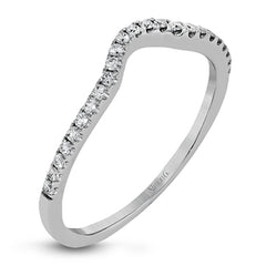 Featuring a pear-shaped double halo, this modern white gold engagement ring is highlighted by .68 ctw of round cut white diamonds.