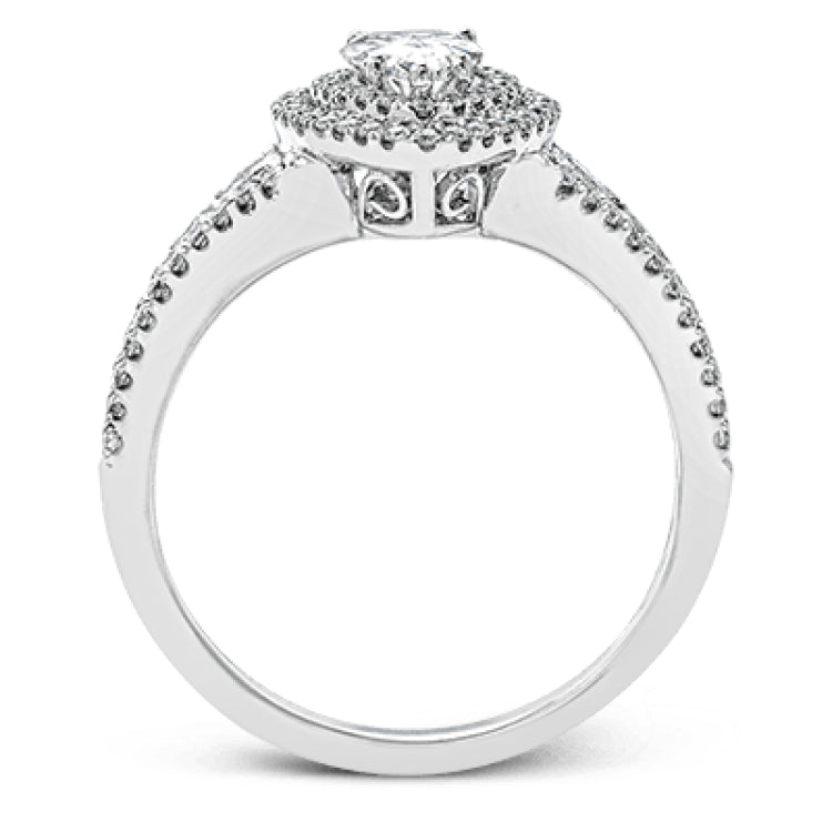 Featuring a pear-shaped double halo, this modern white gold engagement ring is highlighted by .68 ctw of round cut white diamonds.