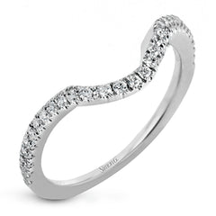 Featuring an exquisite contemporary design, this white gold engagement ring features an eye-catching oval double halo complemented by .68 ctw of round cut white diamonds.