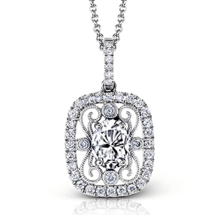 This stunning white gold pendant features a .72 ctw oval shaped sapphire framed by .20 ctw of round white diamonds and a lovely filigree detail.