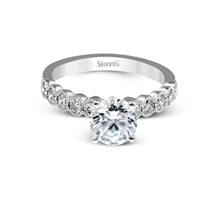 This engagement and wedding band set combines old and new with 1.09 ctw of round brilliant diamonds bezel set into 18k white gold, accented with vintage-inspired milgrain.