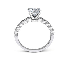 This engagement and wedding band set combines old and new with 1.09 ctw of round brilliant diamonds bezel set into 18k white gold, accented with vintage-inspired milgrain.