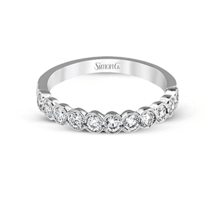 This engagement and wedding band set combines old and new with 1.09 ctw of round brilliant diamonds bezel set into 18k white gold, accented with vintage-inspired milgrain.