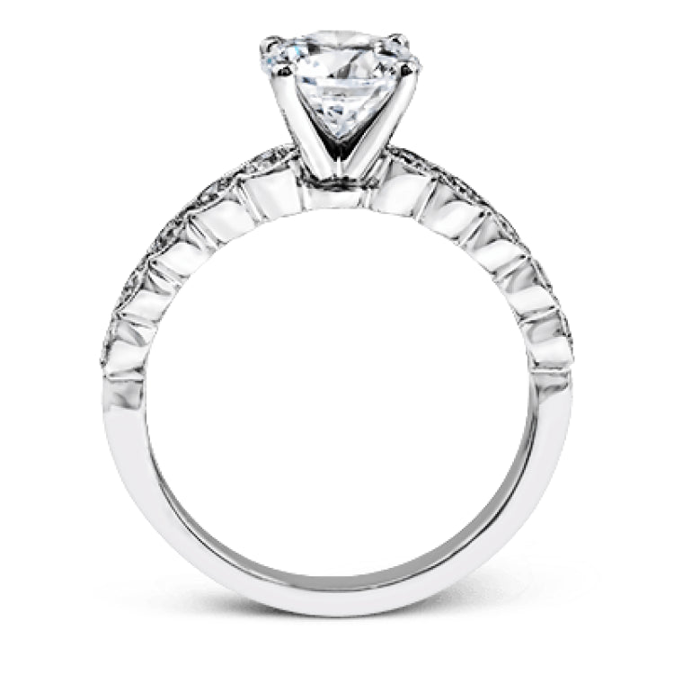 This engagement and wedding band set combines old and new with 1.09 ctw of round brilliant diamonds bezel set into 18k white gold, accented with vintage-inspired milgrain.