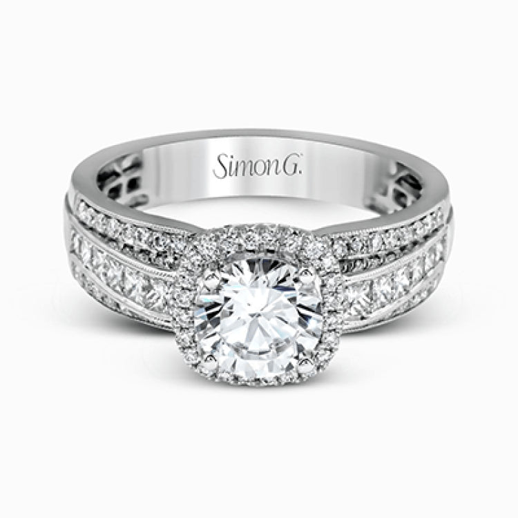 Featuring an impressive halo, this contemporary white gold engagement ring is accented by .22 ctw of round cut white diamonds and .42 ctw princess cut diamonds.