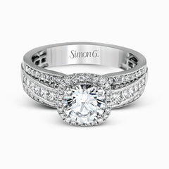 Featuring an impressive halo, this contemporary white gold engagement ring is accented by .22 ctw of round cut white diamonds and .42 ctw princess cut diamonds.