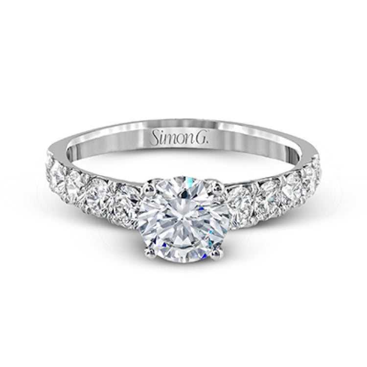 Simple yet dazzling, this white gold engagement ring features .89 ctw of round white diamonds set into the shank.