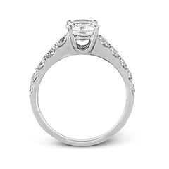Simple yet dazzling, this white gold engagement ring features .89 ctw of round white diamonds set into the shank.