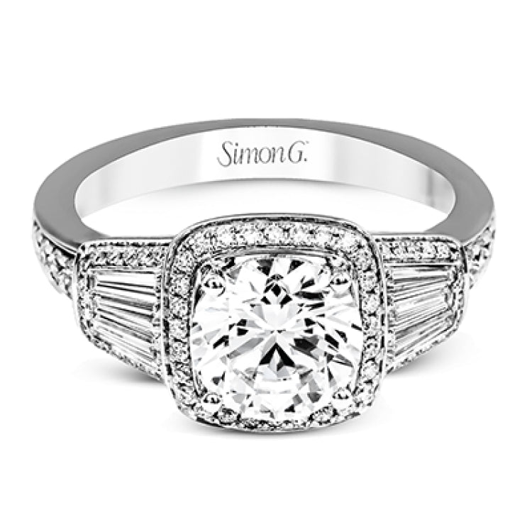 This design is a modern take on a classic design, with .29 ctw of round diamonds set into its halo and sides, and .31 ctw of baguette diamonds flanking the center stone.