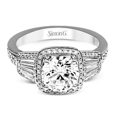 This design is a modern take on a classic design, with .29 ctw of round diamonds set into its halo and sides, and .31 ctw of baguette diamonds flanking the center stone.