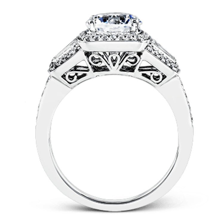 This design is a modern take on a classic design, with .29 ctw of round diamonds set into its halo and sides, and .31 ctw of baguette diamonds flanking the center stone.