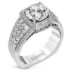 This romantic white gold contemporary ring is accentuated by .25 ctw of glistening round cut white diamonds and .94 ctw of princess cut diamonds.