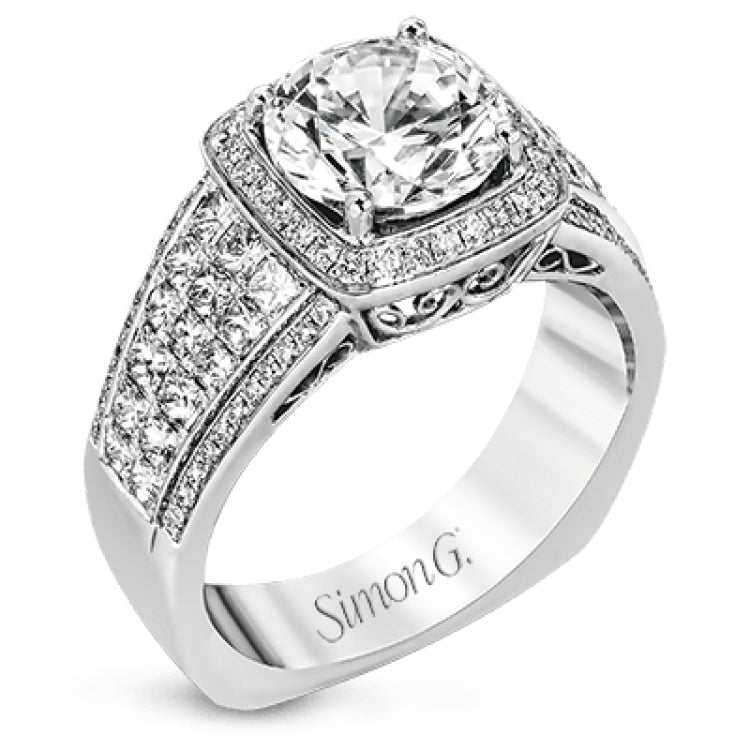 This romantic white gold contemporary ring is accentuated by .25 ctw of glistening round cut white diamonds and .94 ctw of princess cut diamonds.