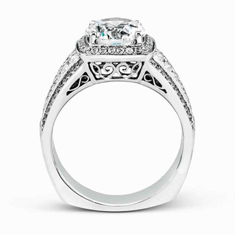 This romantic white gold contemporary ring is accentuated by .25 ctw of glistening round cut white diamonds and .94 ctw of princess cut diamonds.
