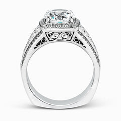 This romantic white gold contemporary ring is accentuated by .25 ctw of glistening round cut white diamonds and .94 ctw of princess cut diamonds.