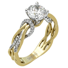 This impressive contemporary two-tone engagement ring features a unique twisting design on the shank, which is complemented by .17 ctw of round cut white diamonds.
