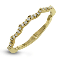 This impressive contemporary two-tone engagement ring features a unique twisting design on the shank, which is complemented by .17 ctw of round cut white diamonds.